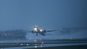 Airplane landing in storm weather rain